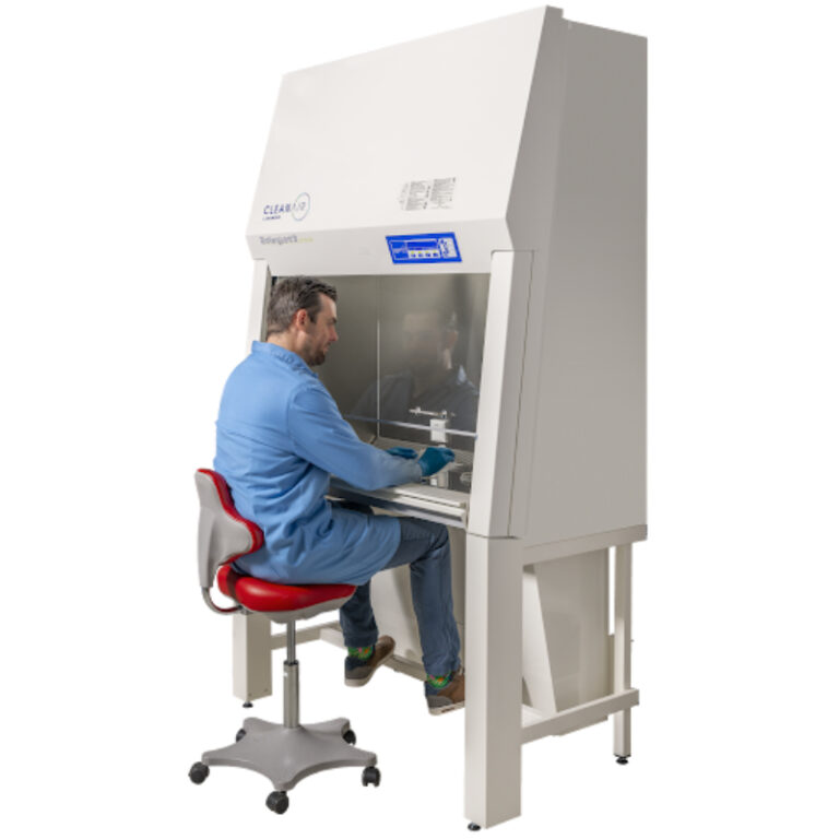 Lab technician working on a CleanAir by Baker Biovanguard Class II biosafety cabinet in a microbiology lab