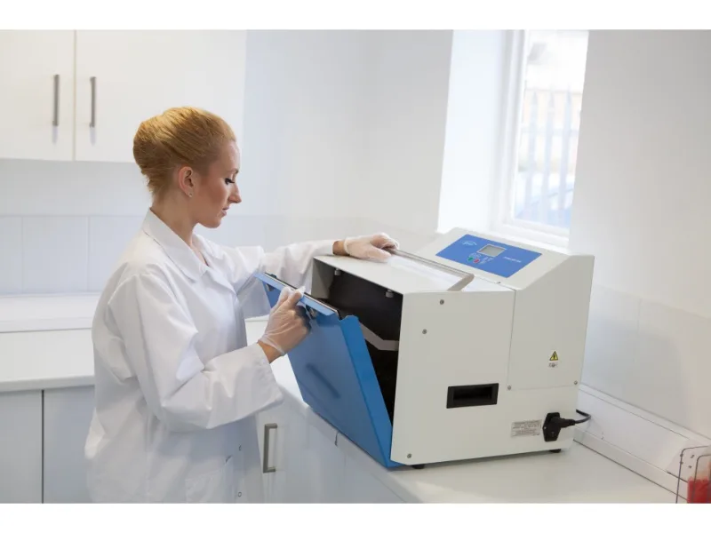 Stomacher 3500 laboratory blender for large volume food and environmental sample processing. Scientist opening unit