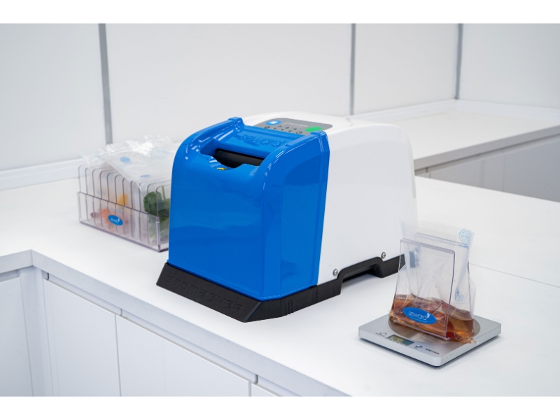Stomacher 80 Micro Biomaster lab blender for small volume microbiological sample preparation. With bag rack and bag opener on scale