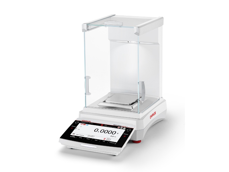 High-precision Ohaus Explorer Plus analytical balance with glass draftshield and motorized leveling system.