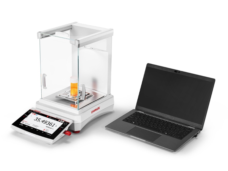 Ohaus Explorer Plus semi-micro balance connected to a laptop via USB for efficient lab data transfer.